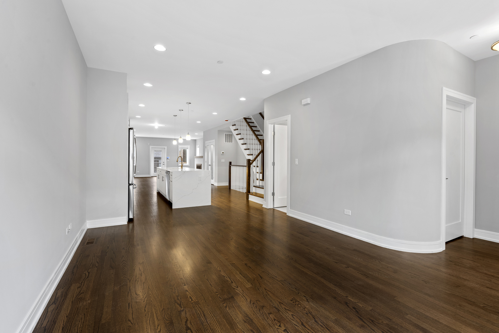 3231 South Shields Avenue Chicago, IL 60616 - Photo 8 of 58 a view of a kitchen with a fridge and wooden floor
