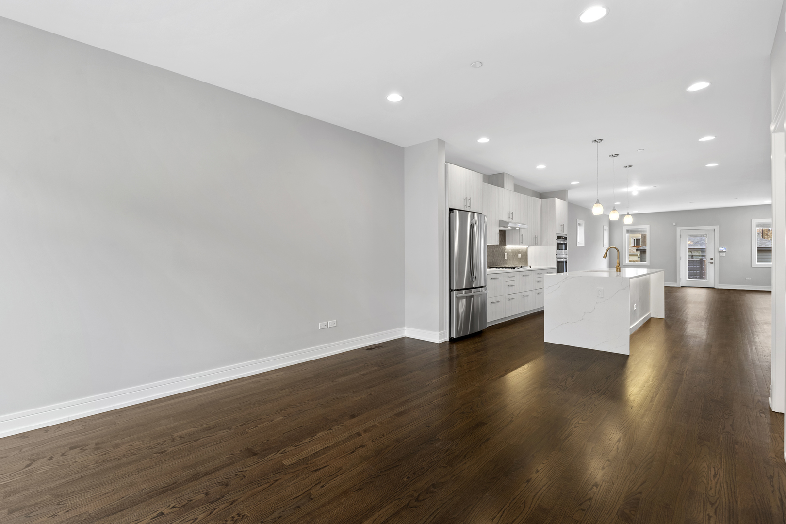3231 South Shields Avenue Chicago, IL 60616 - Photo 9 of 58 a view of a kitchen with a sink and a refrigerator