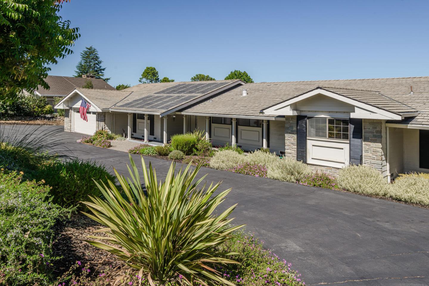 180 Crest Road Woodside, CA 94062 - Photo 1 of 1 a front view of a house with a garden