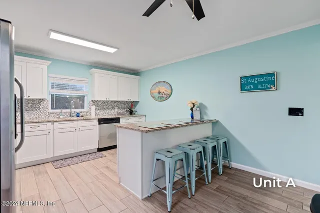 a bedroom with furniture and a wooden floor