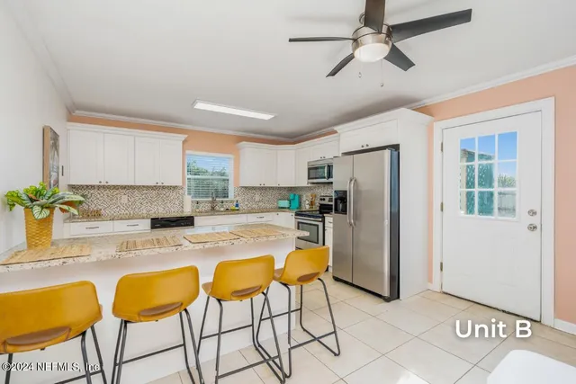a view of cabinets with wooden floor and furniture