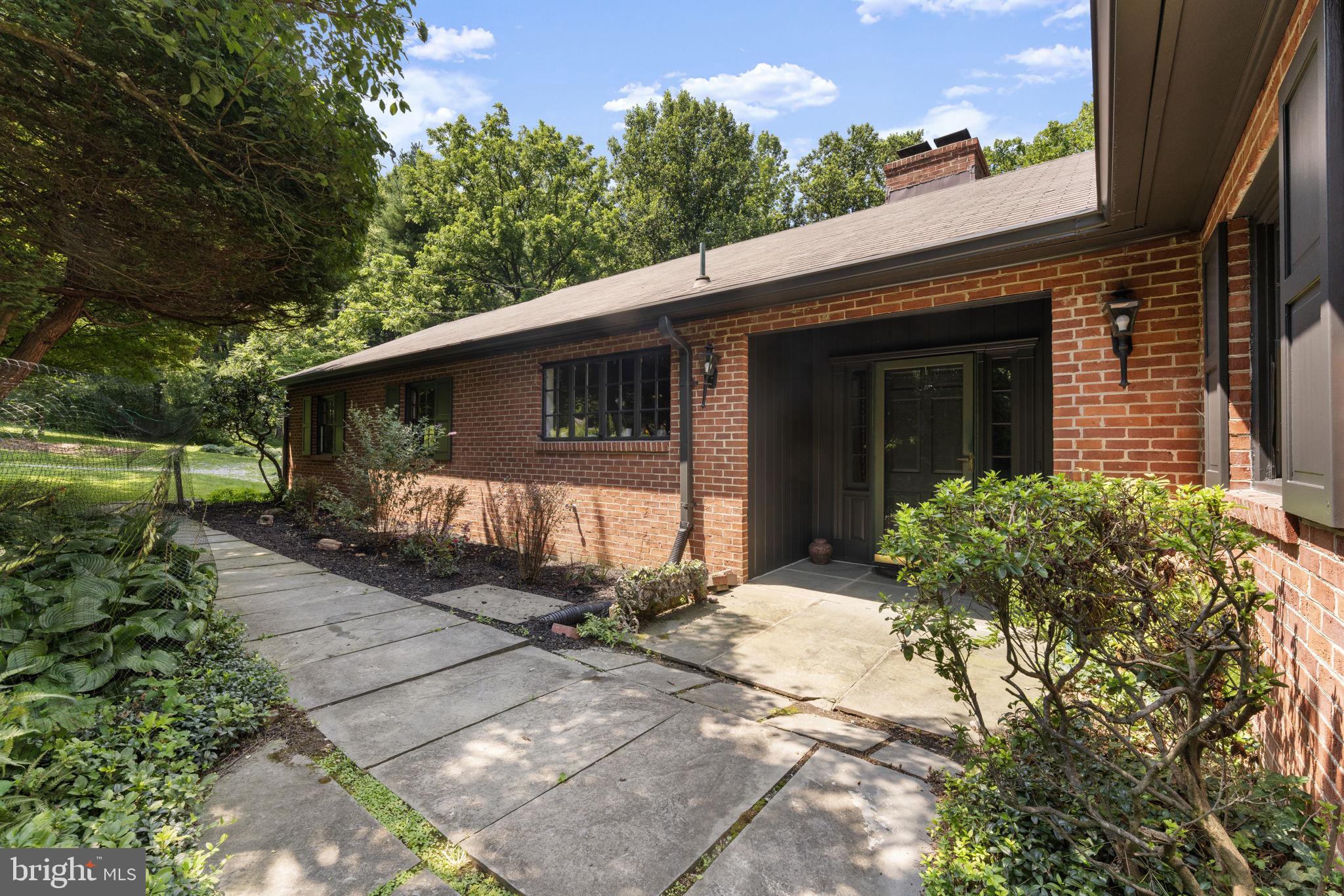 11800 Stoney Creek Road Potomac, MD 20854 - Photo 1 of 78 a front view of a house with garden