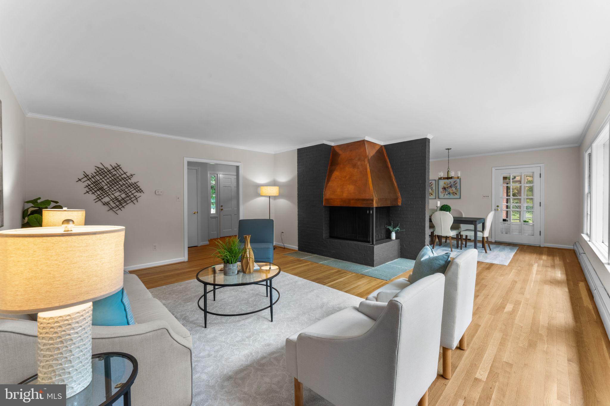 11800 Stoney Creek Road Potomac, MD 20854 - Photo 11 of 78 a living room with furniture and a fireplace