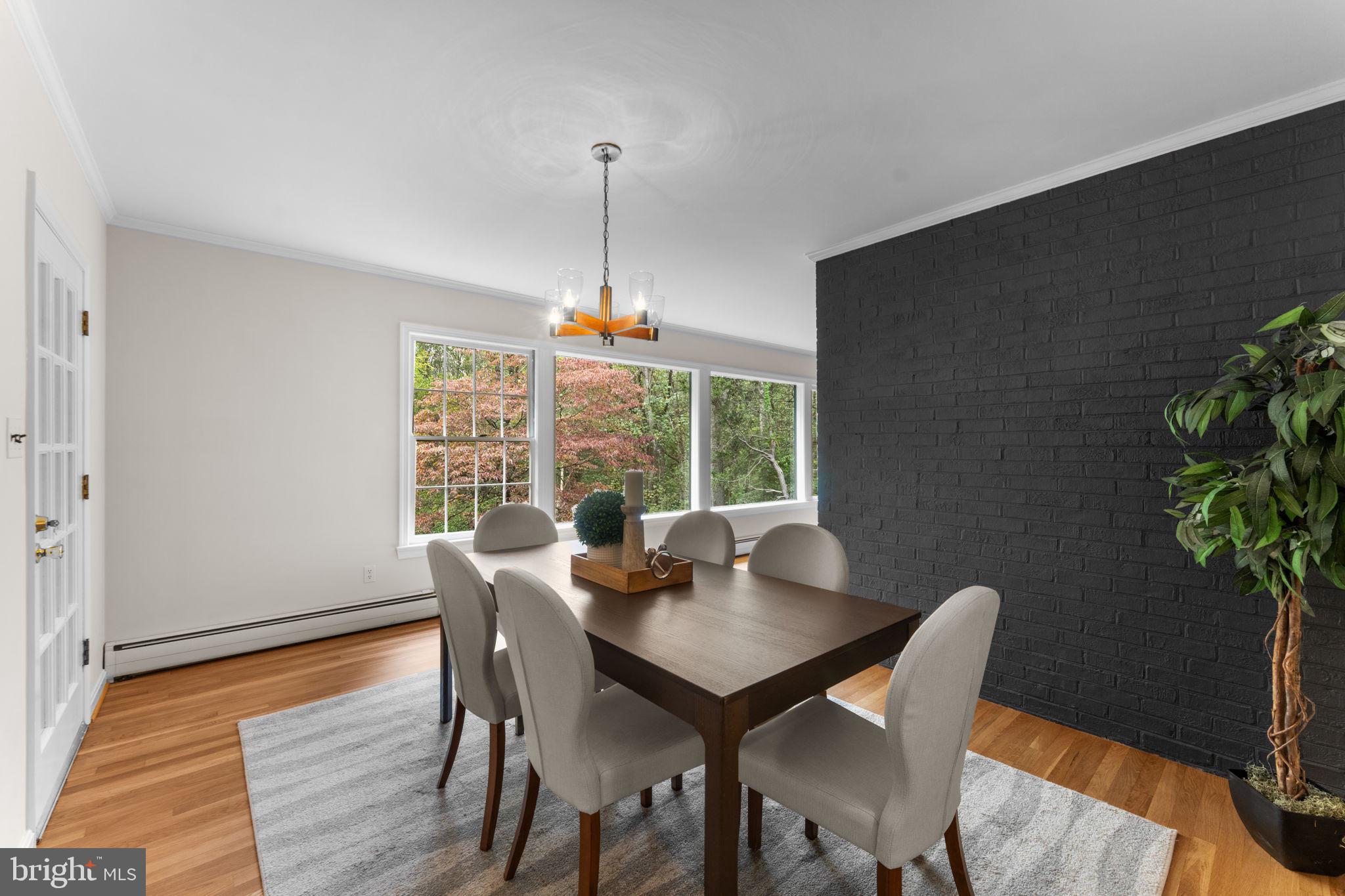 11800 Stoney Creek Road Potomac, MD 20854 - Photo 13 of 78 a view of a dining room with furniture window and wooden floor