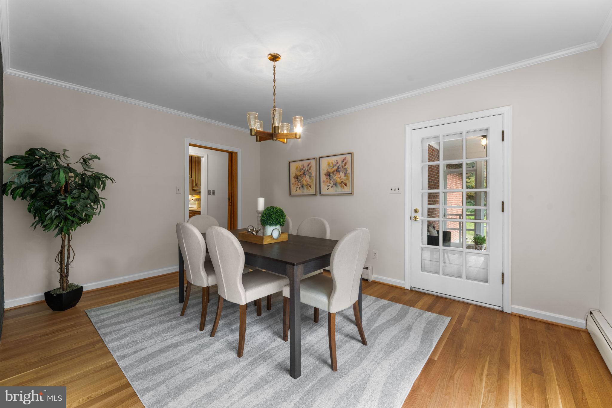 11800 Stoney Creek Road Potomac, MD 20854 - Photo 14 of 78 a view of a dining room with furniture and wooden floor