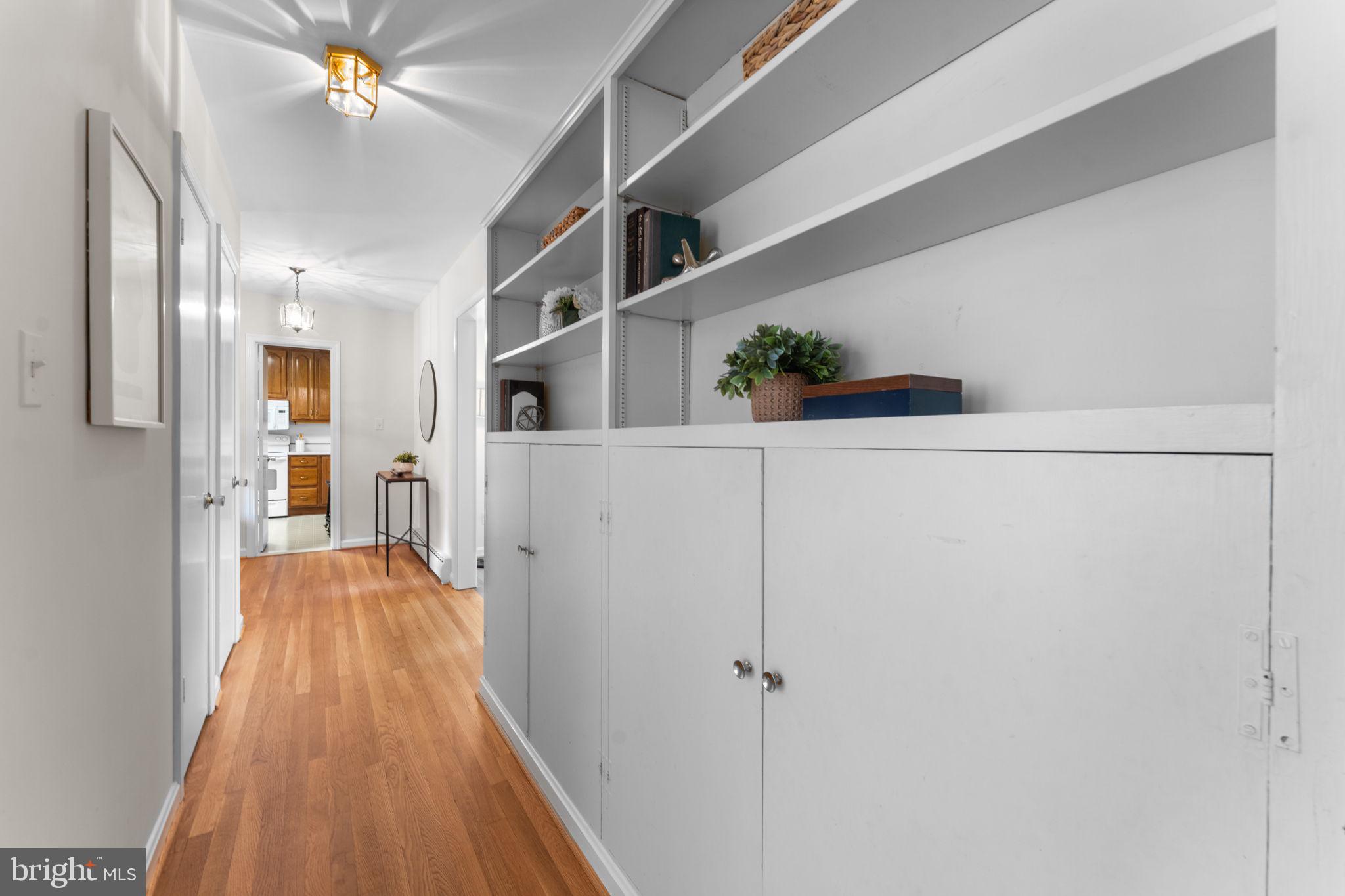 11800 Stoney Creek Road Potomac, MD 20854 - Photo 20 of 78 a view of a hallway with wooden floor and staircase