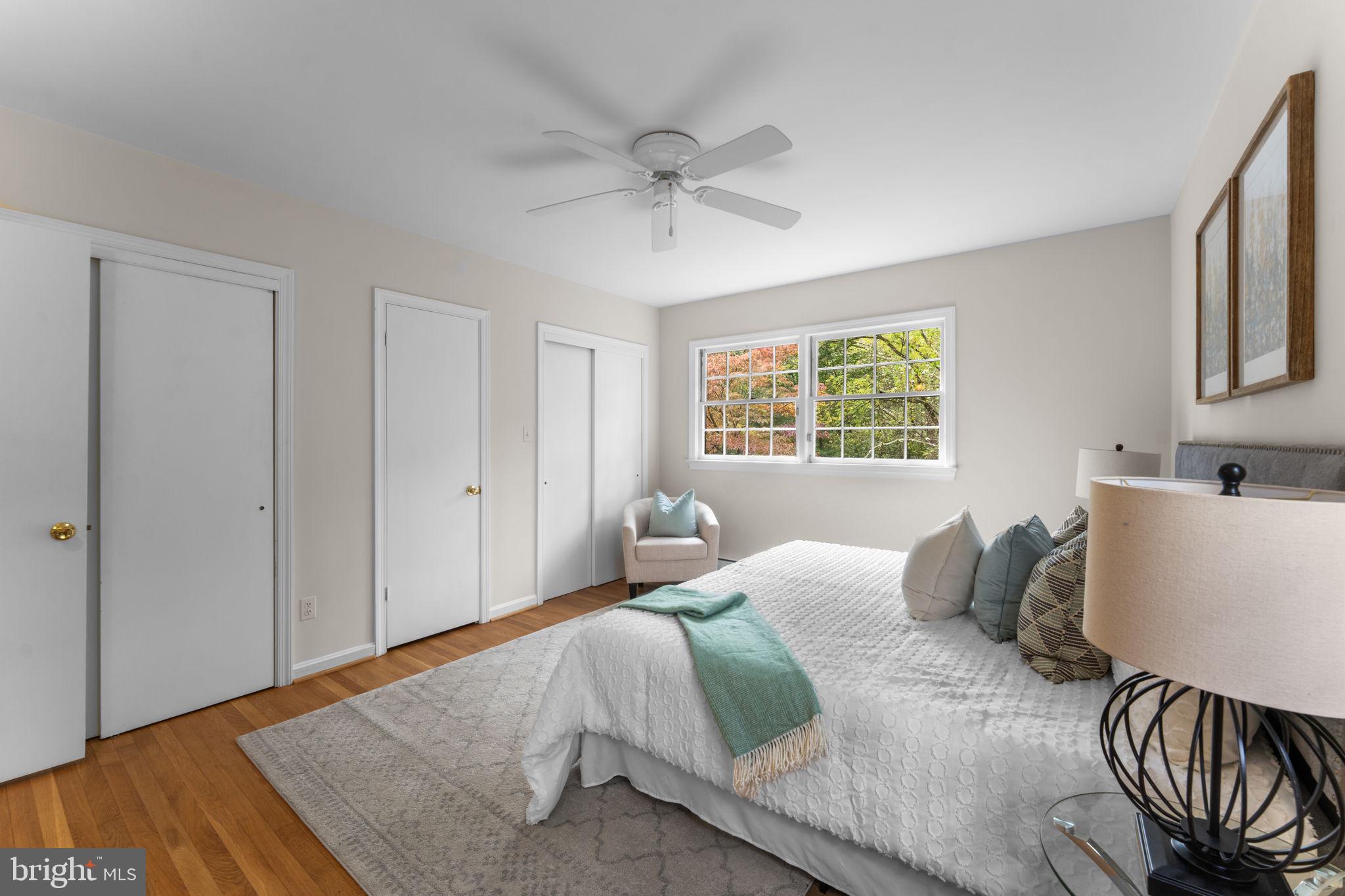 11800 Stoney Creek Road Potomac, MD 20854 - Photo 23 of 78 a bedroom with a bed and a window