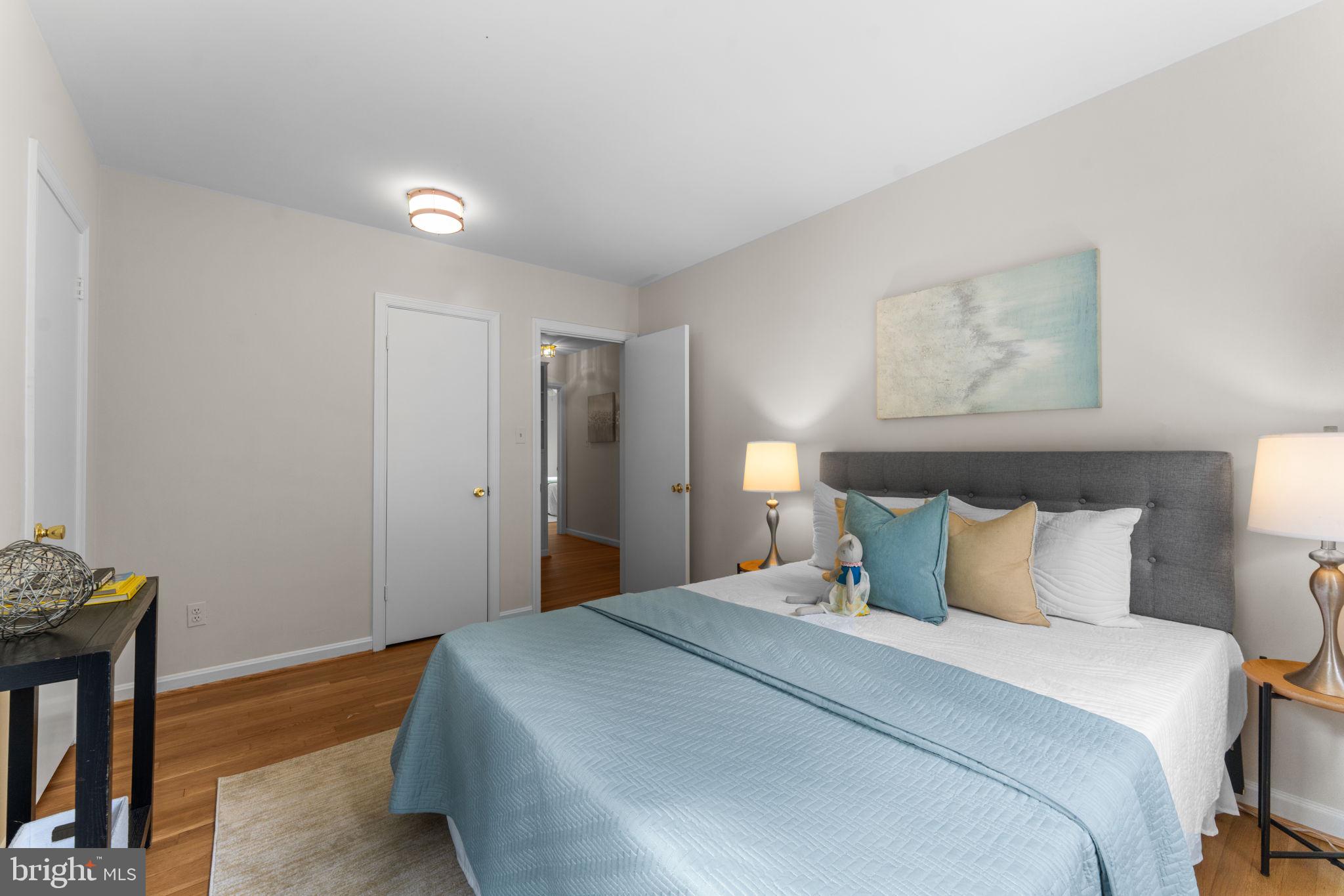 11800 Stoney Creek Road Potomac, MD 20854 - Photo 27 of 78 a bedroom with a bed and a table