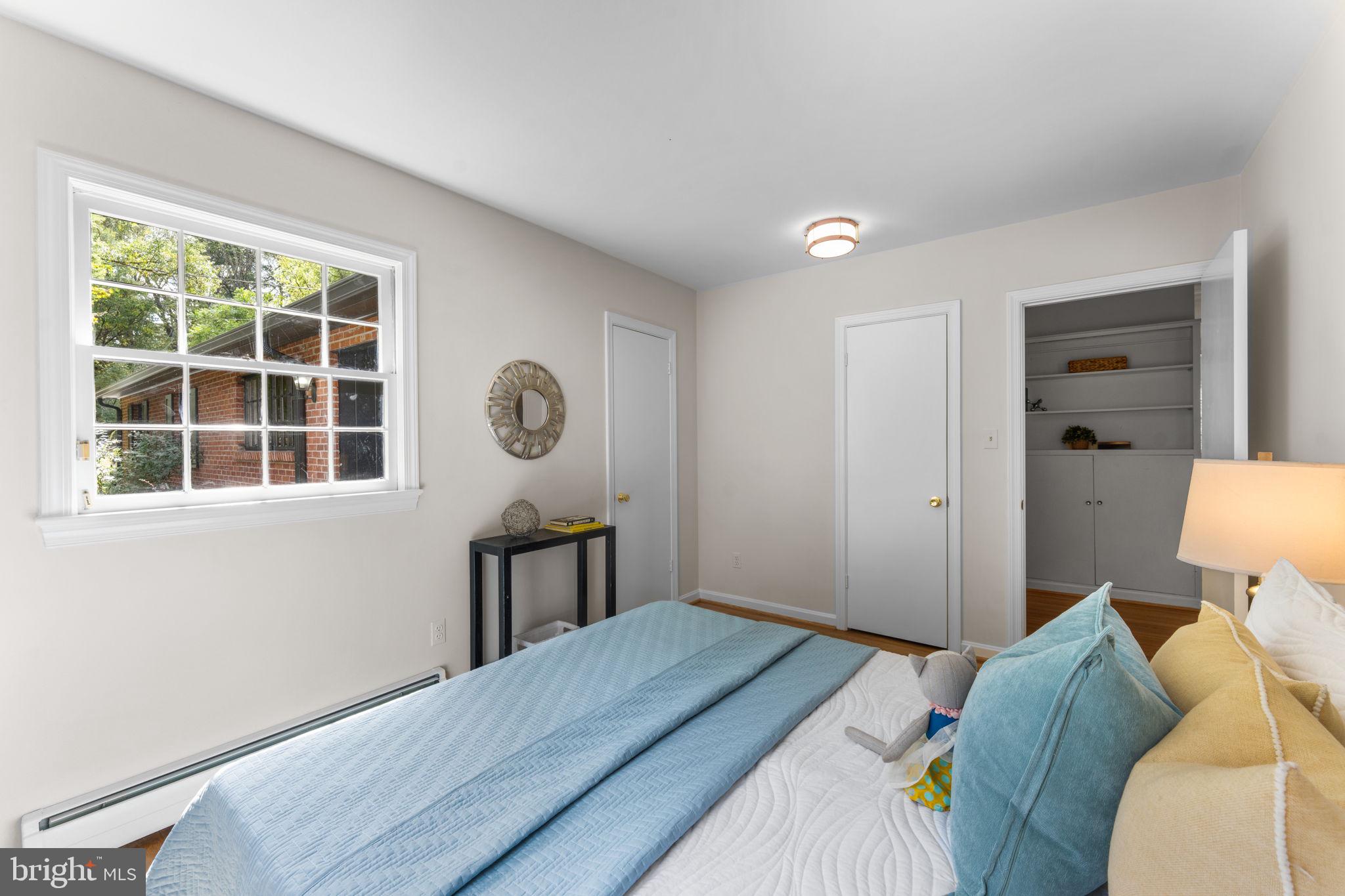 11800 Stoney Creek Road Potomac, MD 20854 - Photo 29 of 78 a bedroom with a bed and a window