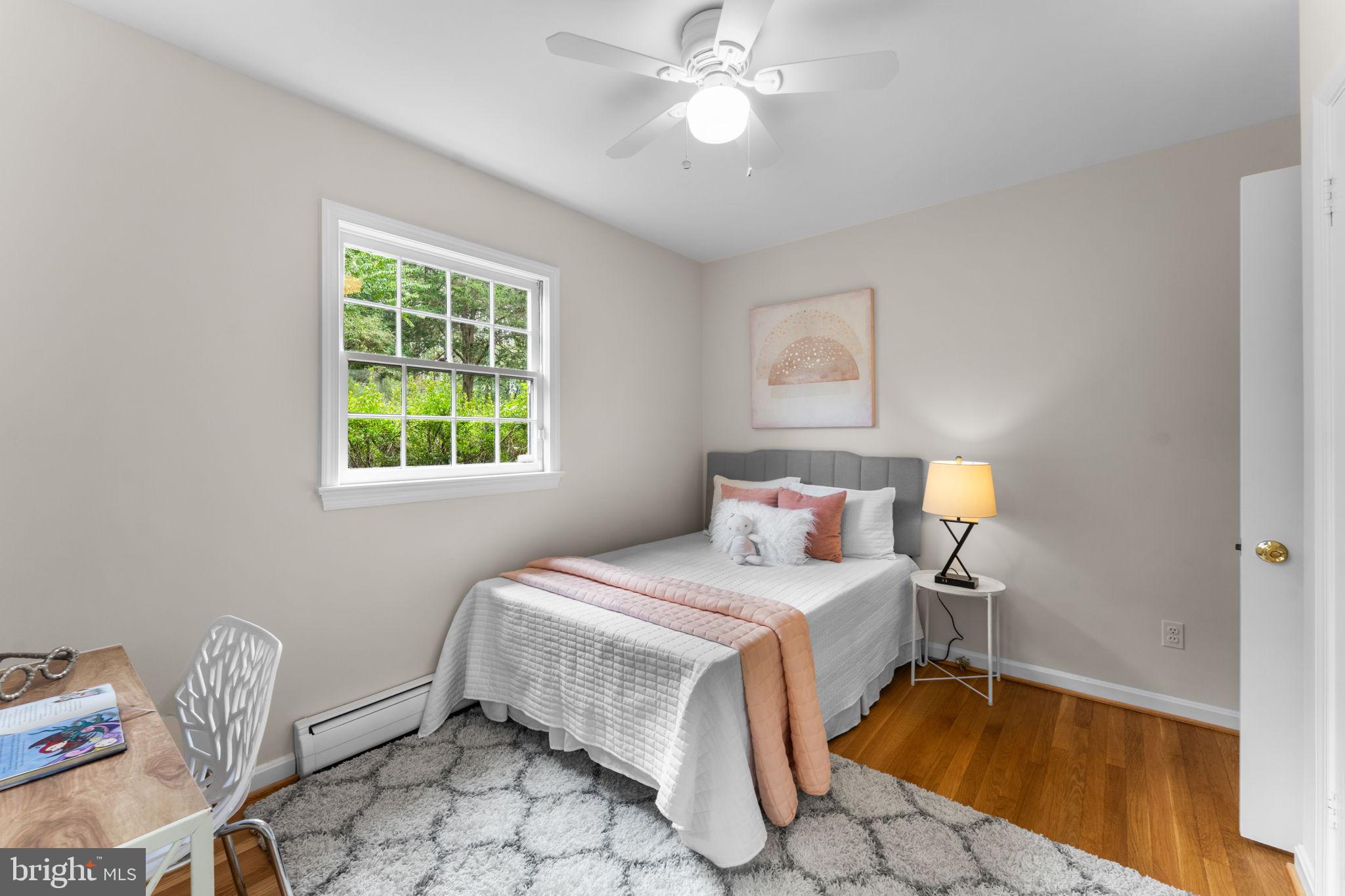 11800 Stoney Creek Road Potomac, MD 20854 - Photo 32 of 78 a bedroom with a bed and a window