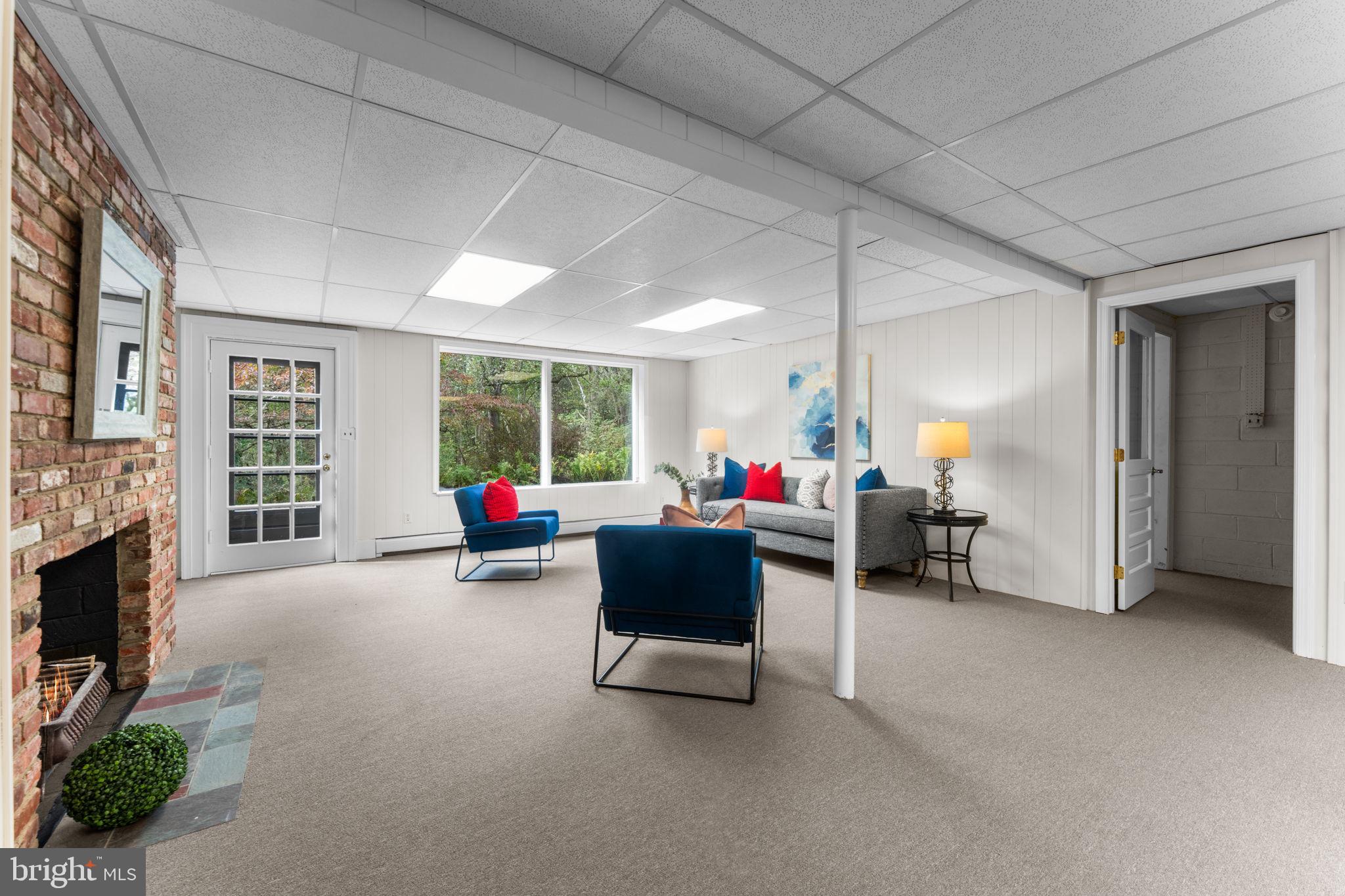 11800 Stoney Creek Road Potomac, MD 20854 - Photo 37 of 78 a living room with furniture and a fireplace