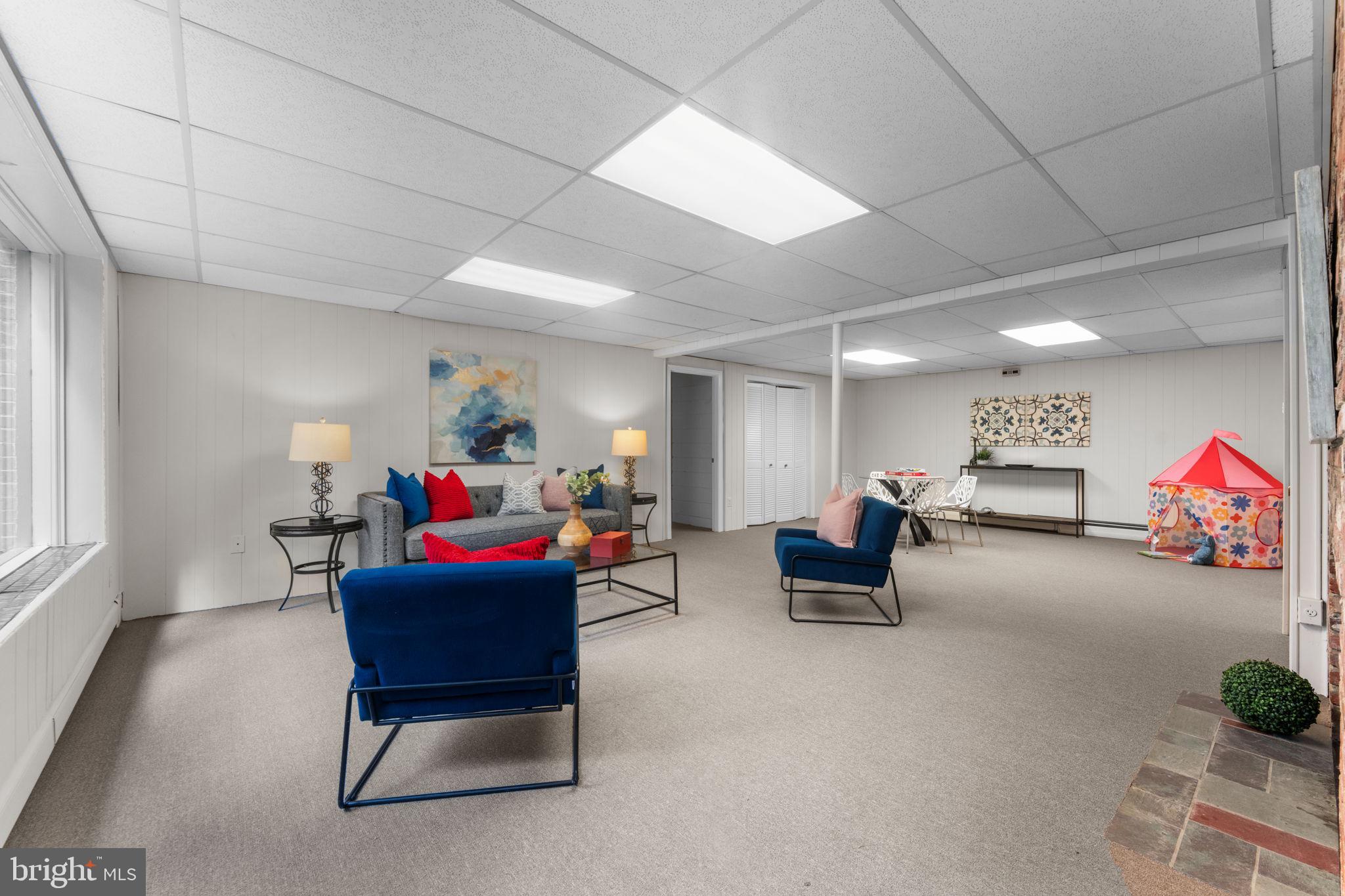 11800 Stoney Creek Road Potomac, MD 20854 - Photo 39 of 78 a living room with furniture and a couch