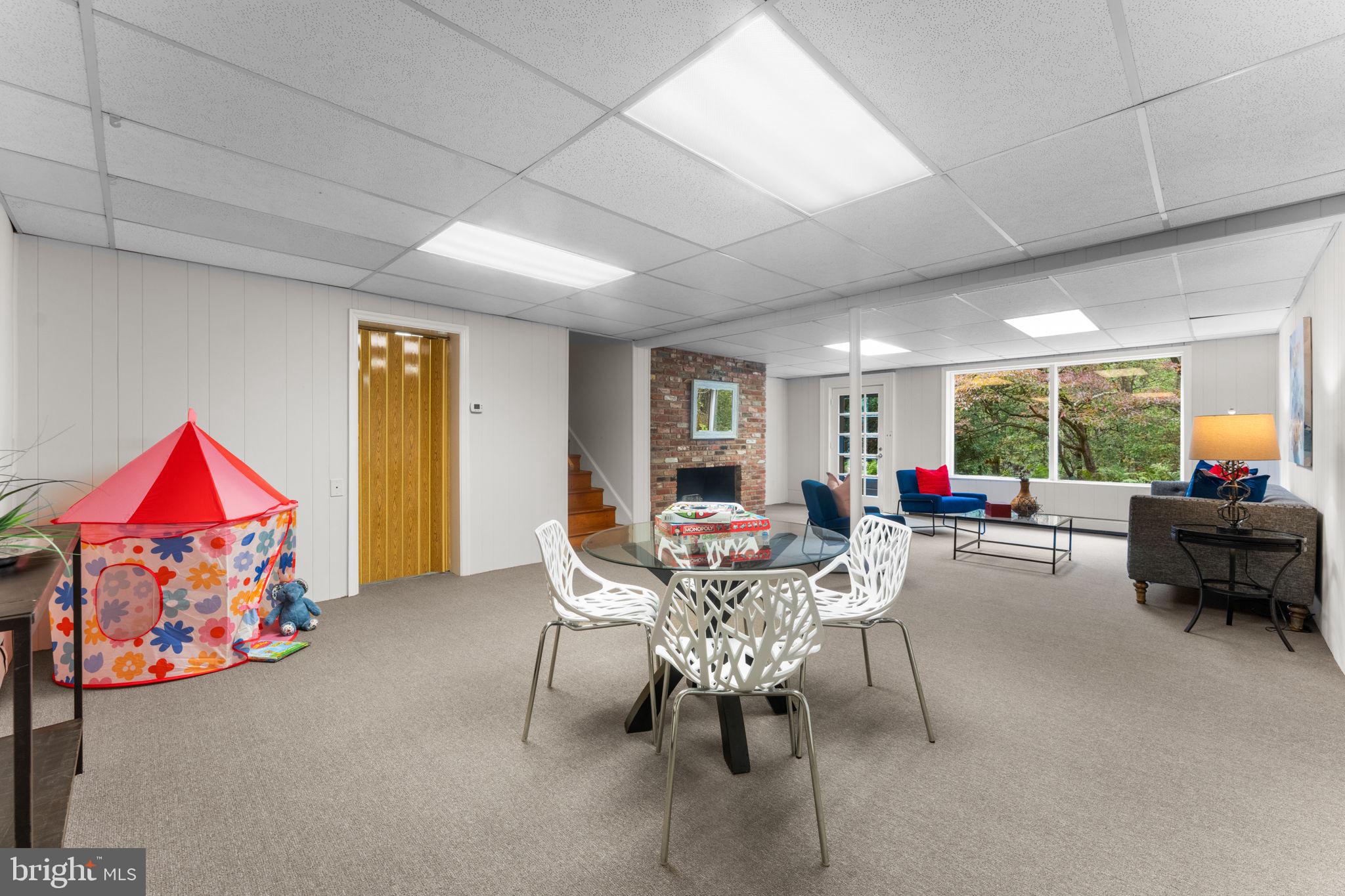 11800 Stoney Creek Road Potomac, MD 20854 - Photo 40 of 78 a living room with furniture and a flat screen tv