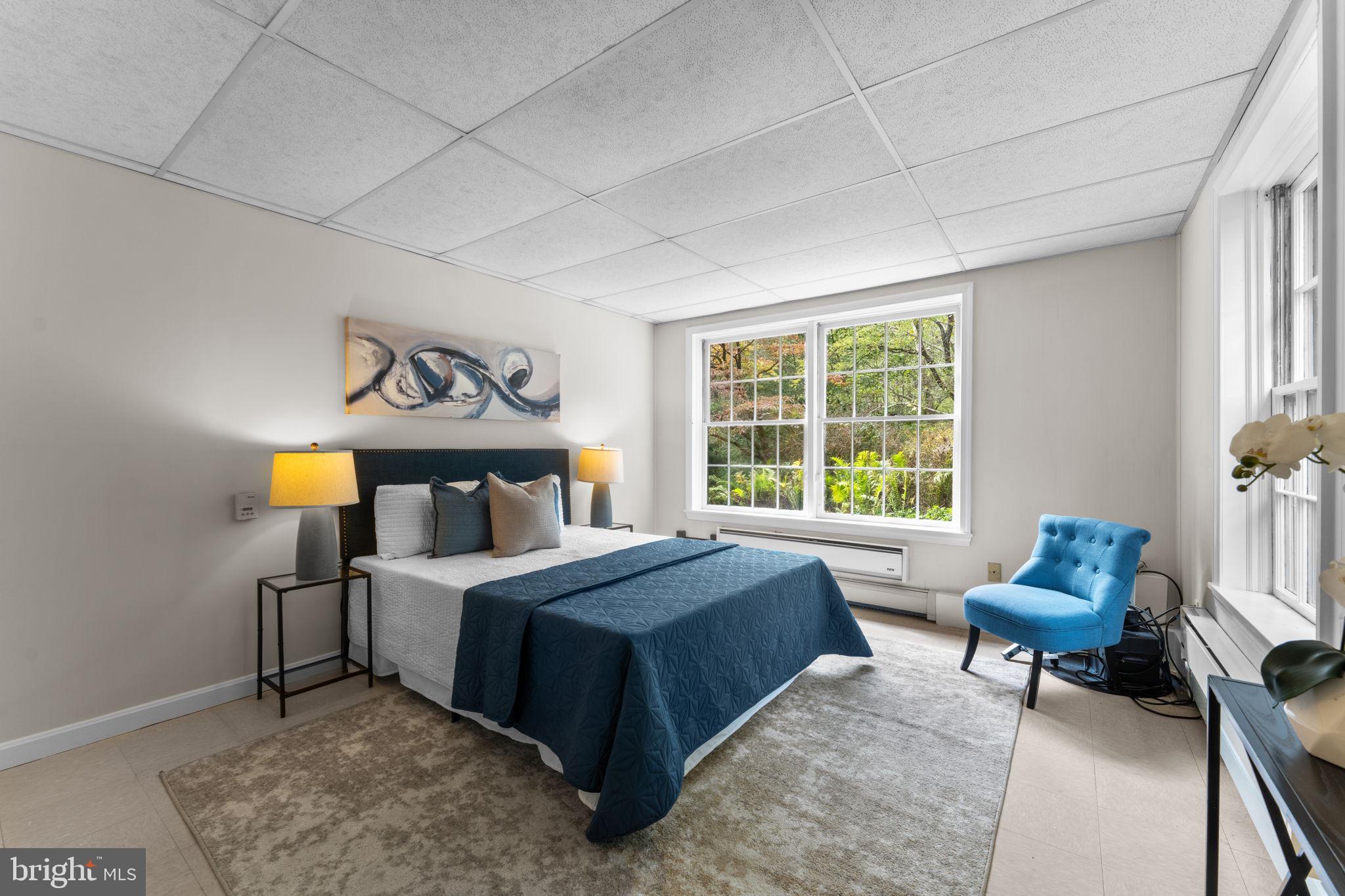 11800 Stoney Creek Road Potomac, MD 20854 - Photo 42 of 78 a bedroom with a bed and a window