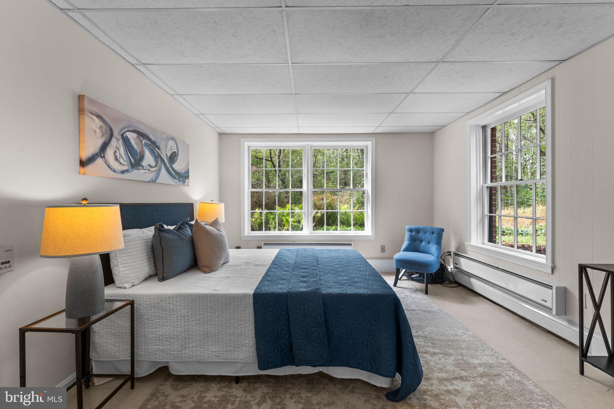 11800 Stoney Creek Road Potomac, MD 20854 - Photo 43 of 78 a bedroom with a bed and glass window