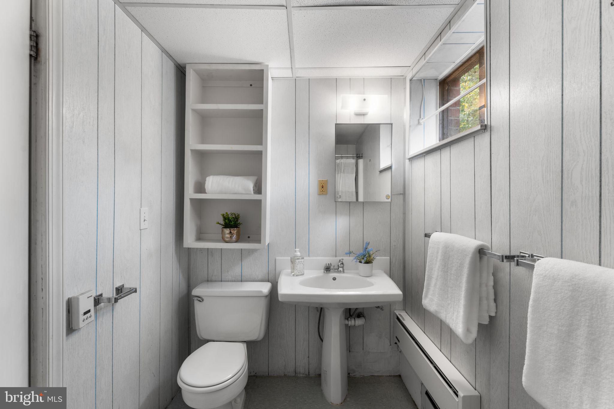 11800 Stoney Creek Road Potomac, MD 20854 - Photo 45 of 78 a bathroom with a sink toilet and shower