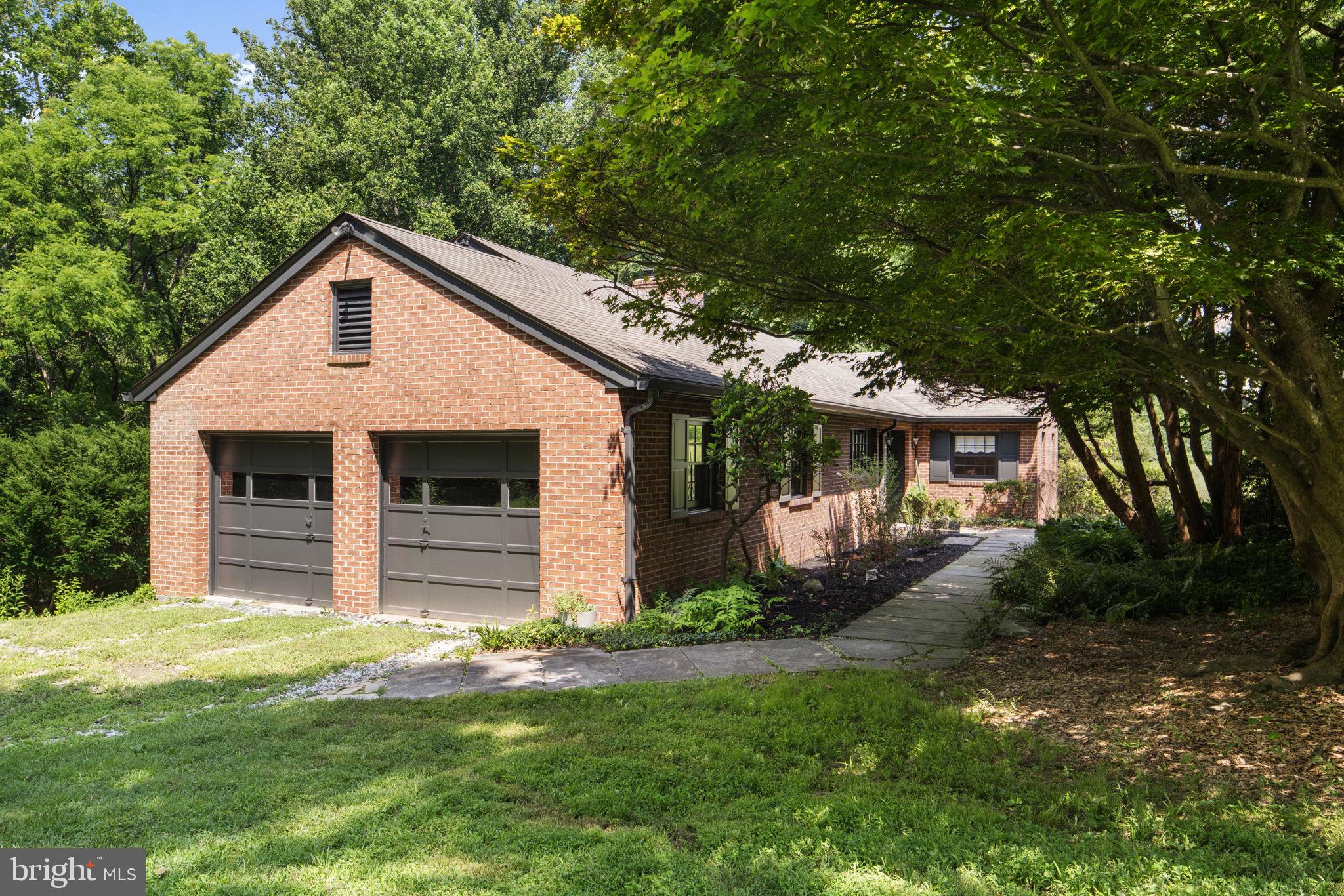 11800 Stoney Creek Road Potomac, MD 20854 - Photo 54 of 78 a front view of a house with a yard