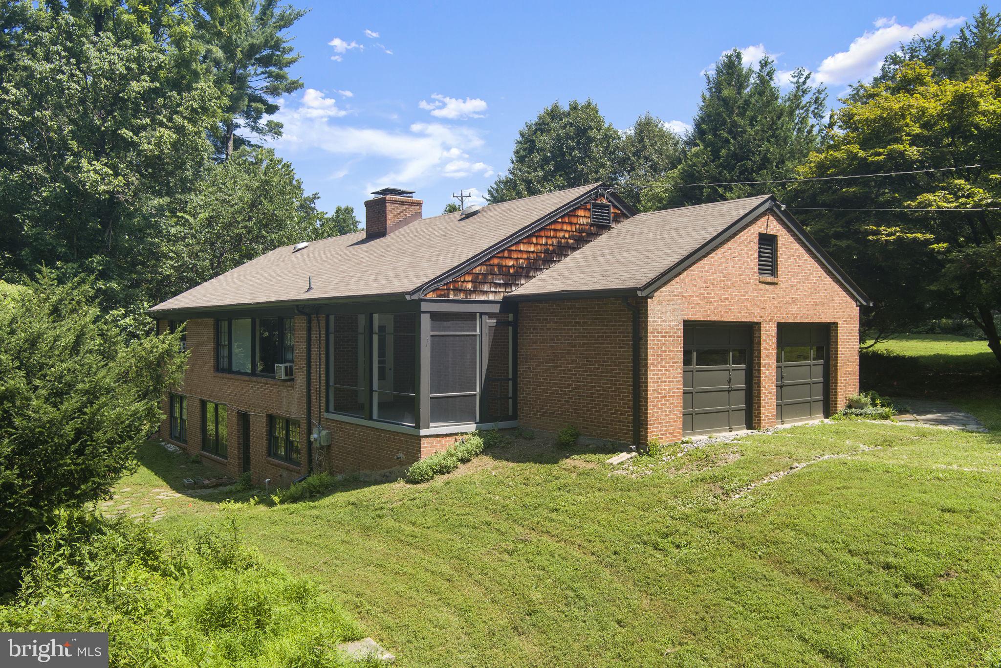 11800 Stoney Creek Road Potomac, MD 20854 - Photo 55 of 78 a front view of a house with a yard