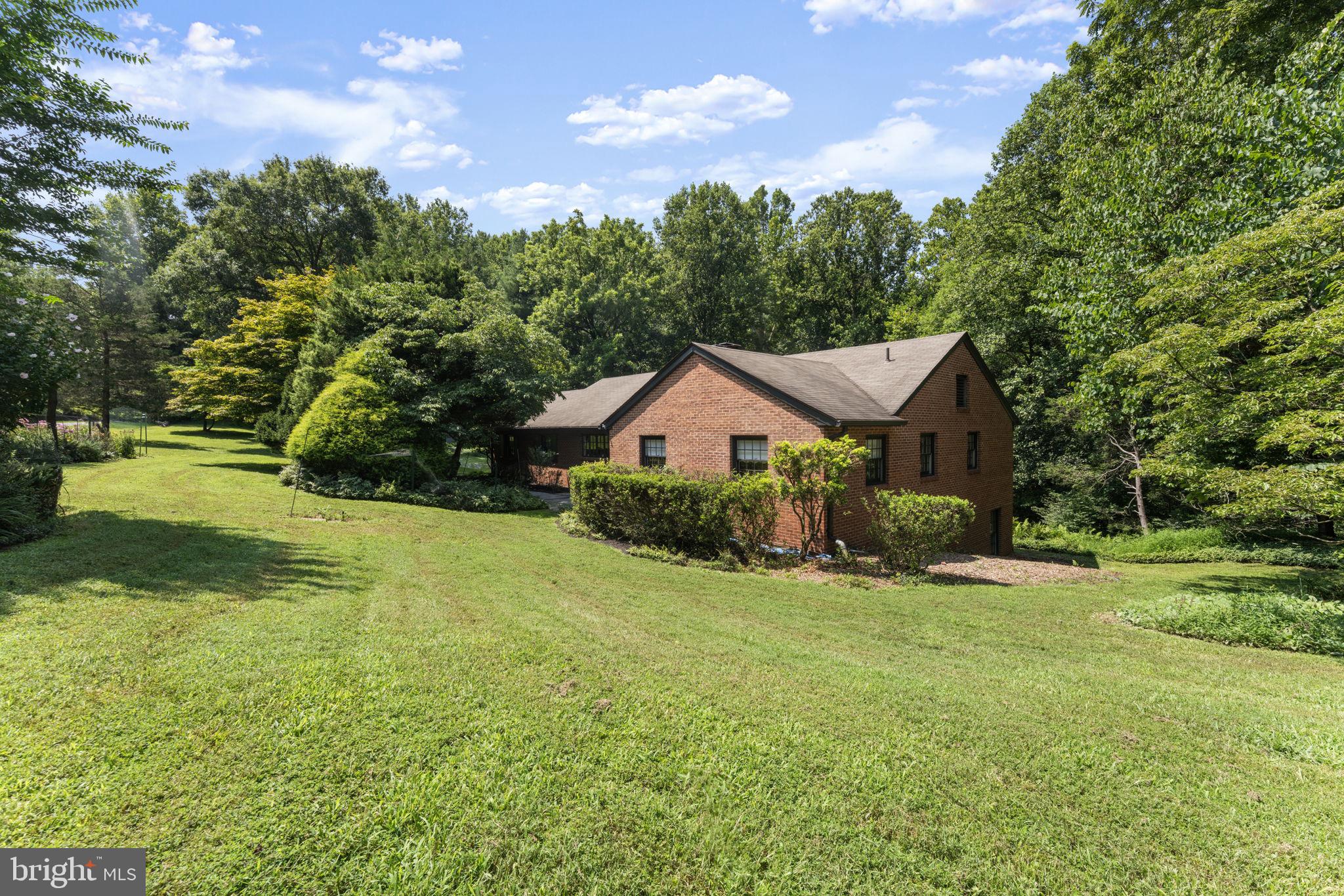 11800 Stoney Creek Road Potomac, MD 20854 - Photo 59 of 78 a front view of house with yard and green space