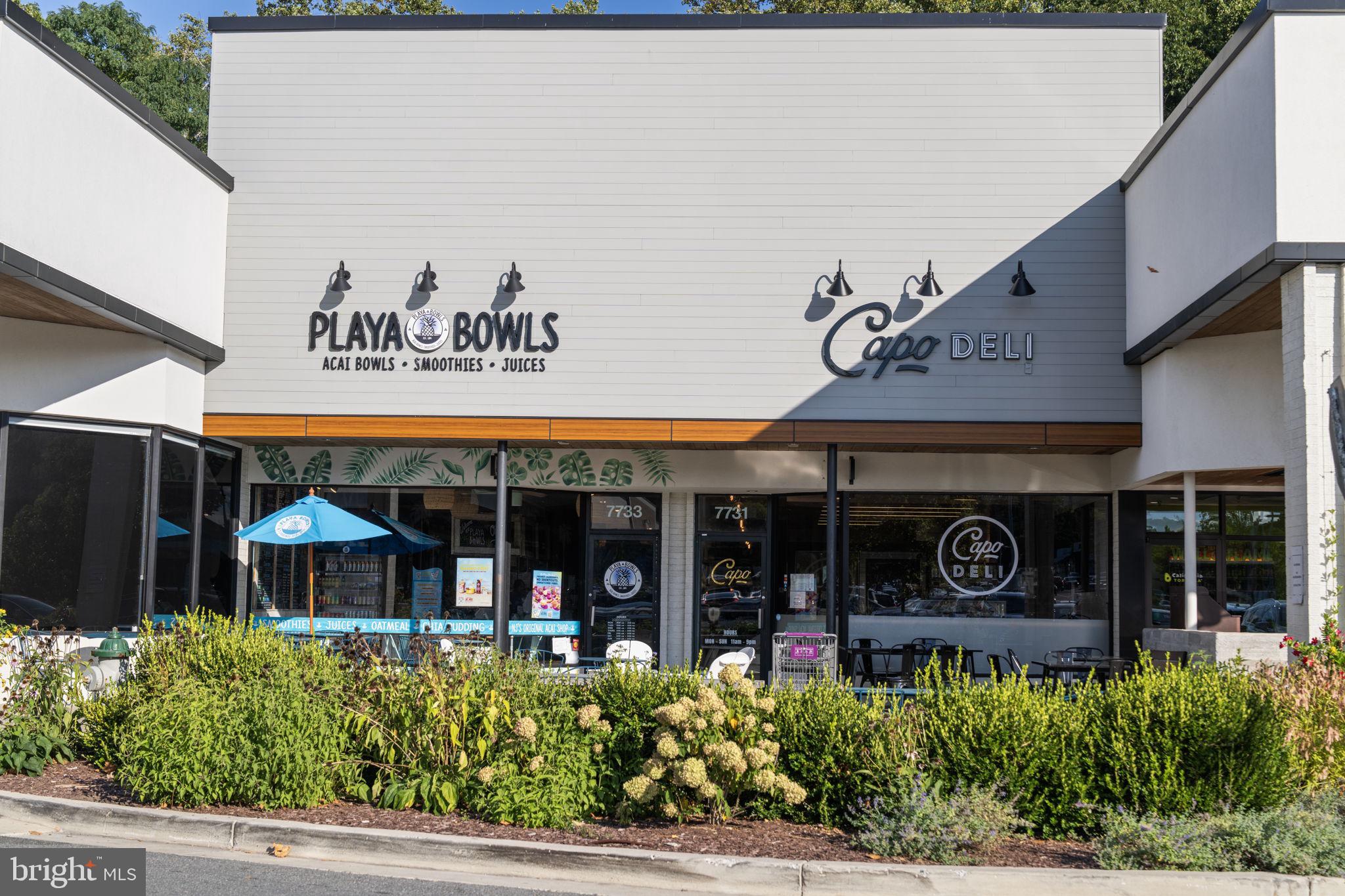 11800 Stoney Creek Road Potomac, MD 20854 - Photo 67 of 78 a view of a cafe with table and chairs in front of it