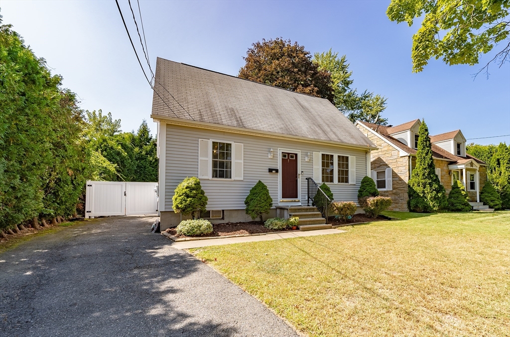 116 Garland Street Springfield, MA 01118 - Photo 2 of 31 a house view with a sitting space and garden