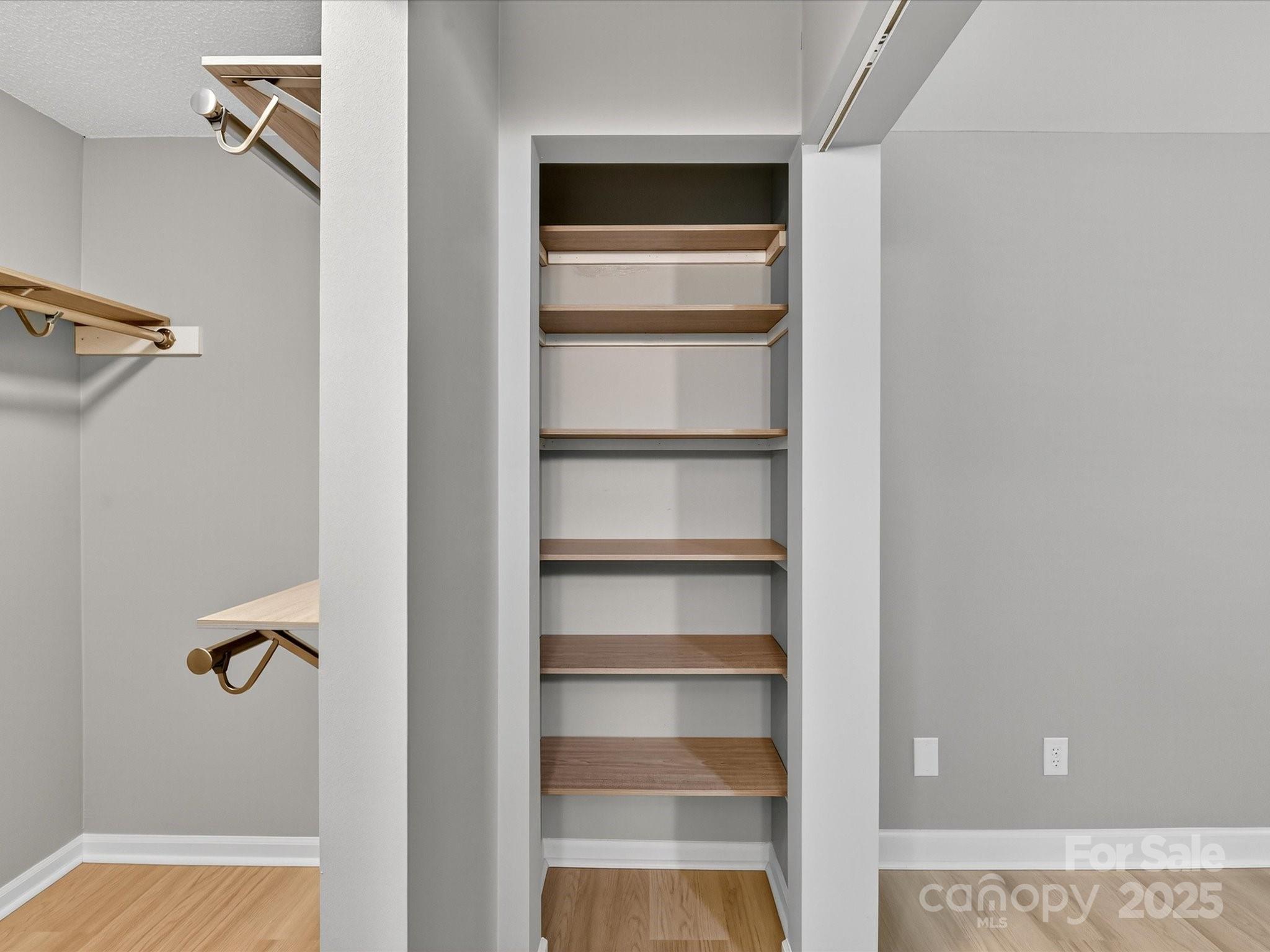 20115 Henderson Road, Unit D Cornelius, NC 28031 - Photo 20 of 44 a view of a room with rack on the wall