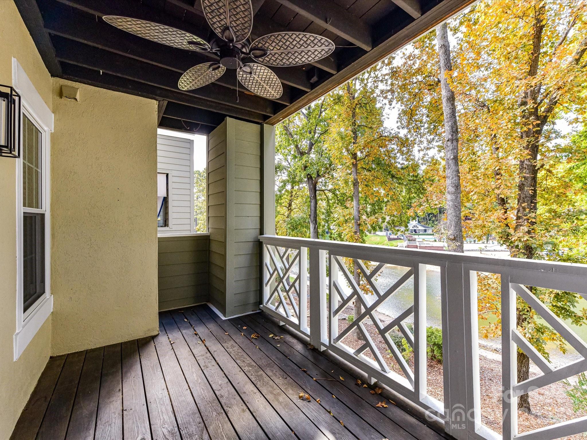 20115 Henderson Road, Unit D Cornelius, NC 28031 - Photo 25 of 44 a view of a balcony with wooden floor