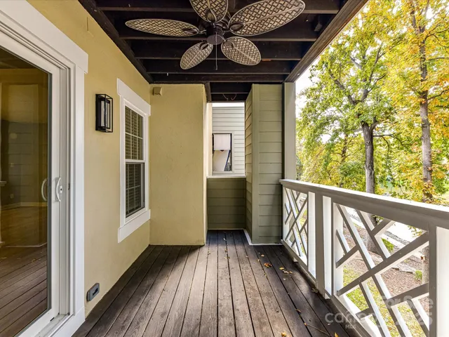 a view of balcony with wooden floor