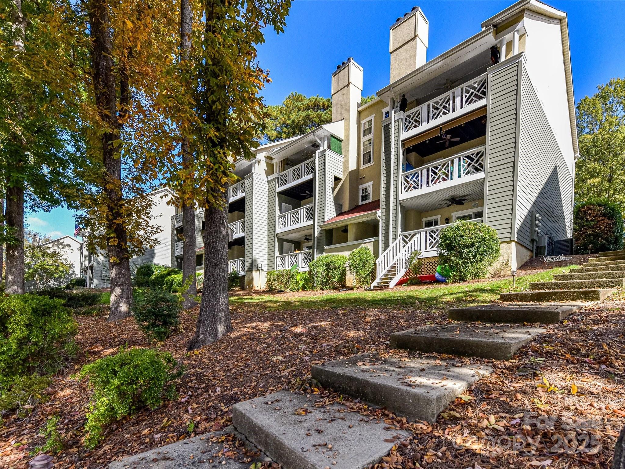 20115 Henderson Road, Unit D Cornelius, NC 28031 - Photo 29 of 44 a front view of a house with garden