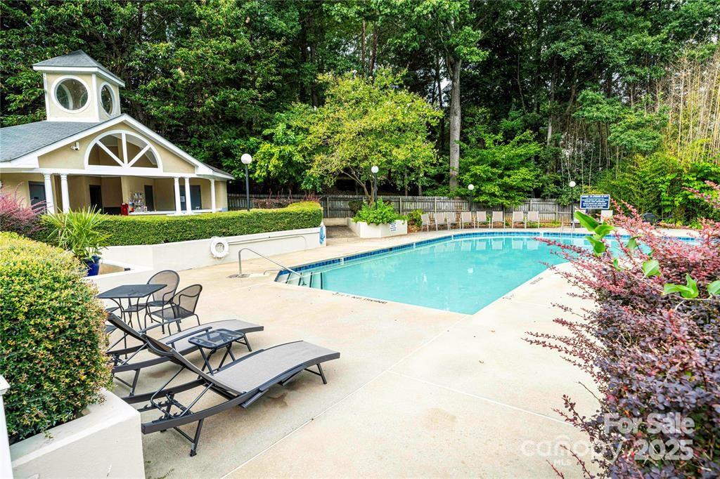 20115 Henderson Road, Unit D Cornelius, NC 28031 - Photo 32 of 44 a view of a house with swimming pool and sitting area