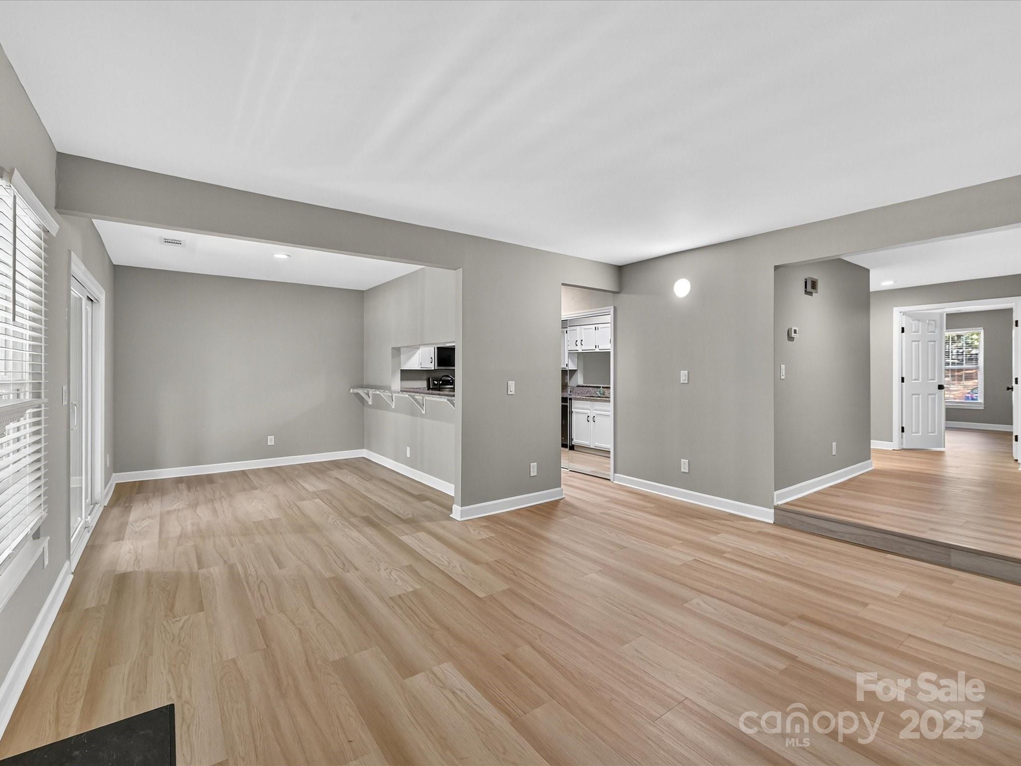 20115 Henderson Road, Unit D Cornelius, NC 28031 - Photo 6 of 44 a view of empty room with wooden floor