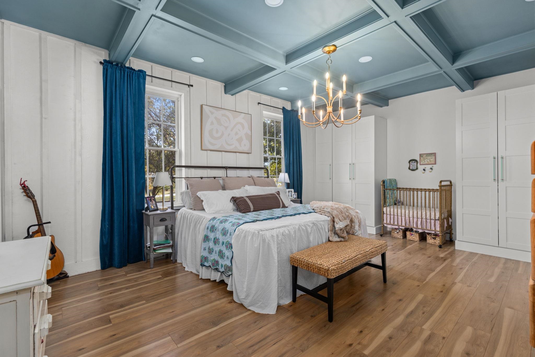 41 County Road 409 Rienzi, MS 38865 - Photo 13 of 40 Bedroom featuring wood finished floors, beam ceiling, recessed lighting, a chandelier, and coffered ceiling