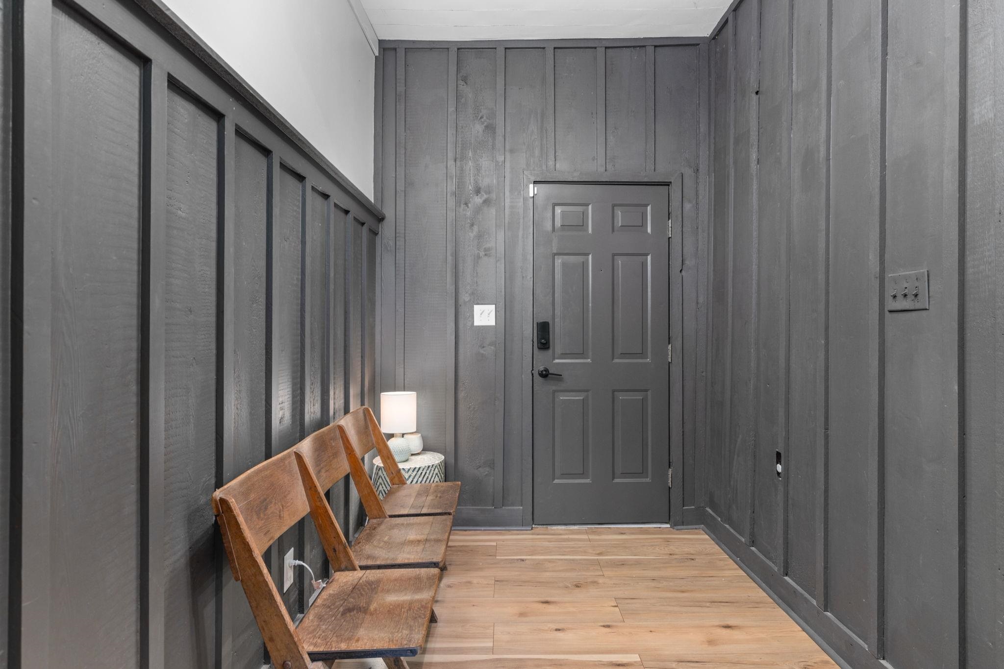41 County Road 409 Rienzi, MS 38865 - Photo 19 of 40 Foyer entrance featuring light wood finished floors and wooden walls