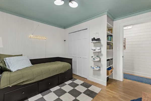 a bedroom with furniture and a chandelier