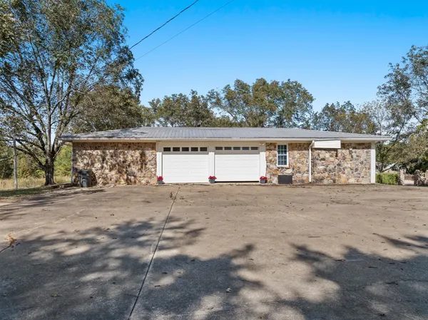 a view of a yard with mountain trees