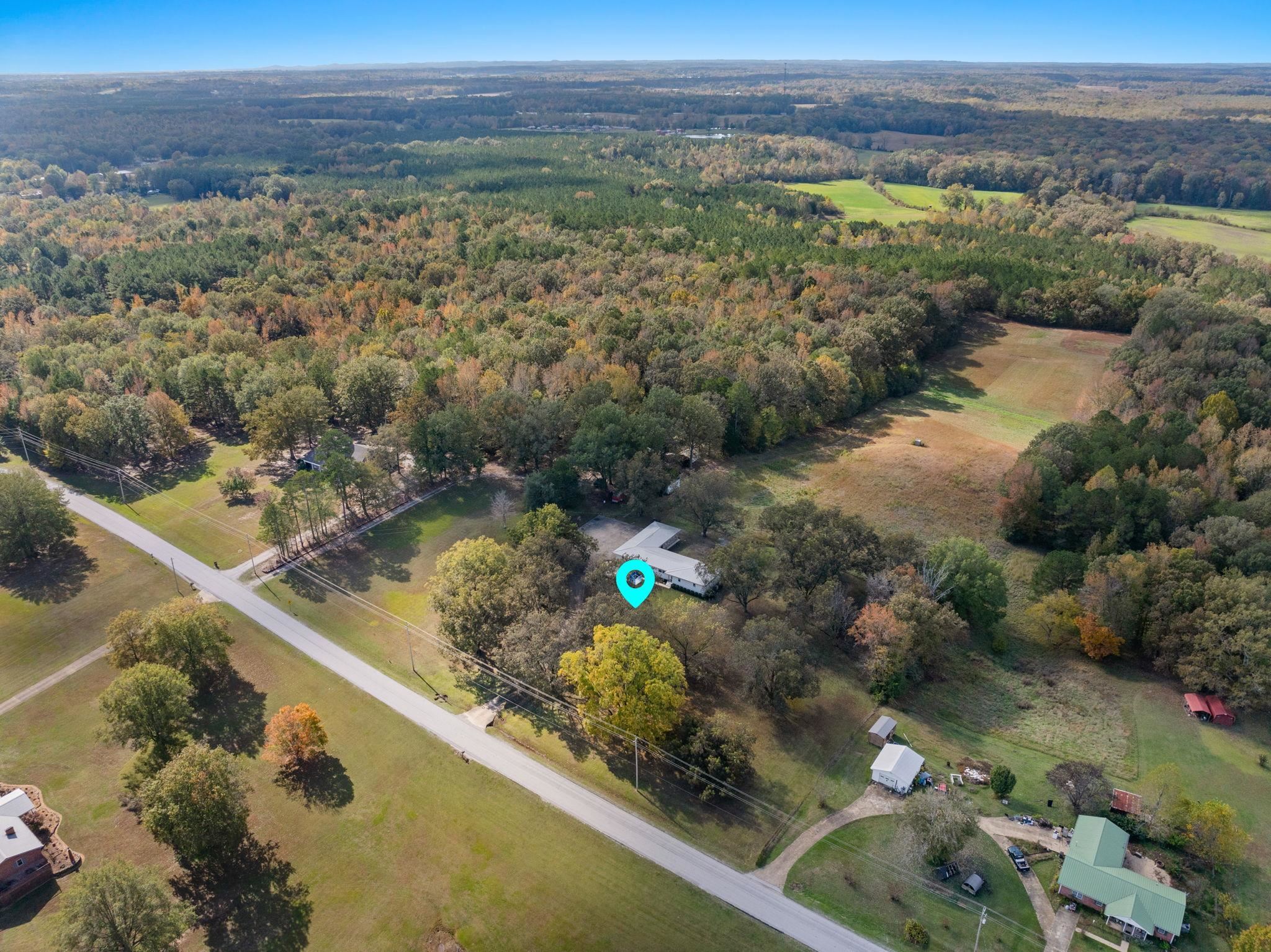 41 County Road 409 Rienzi, MS 38865 - Photo 38 of 40 Aerial view of property and surrounding area featuring a heavily wooded area
