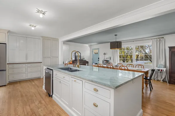 a kitchen with sink and cabinets