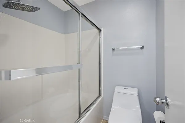 a front view of a house with swimming pool having outdoor seating