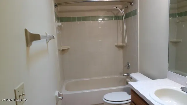 a bathroom with a sink toilet and bathtub