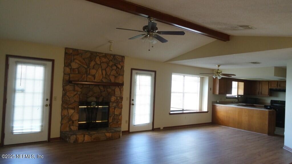 1389 Pawnee Street Orange Park, FL 32065 - Photo 2 of 13 a view of a kitchen with a sink dishwasher and a fireplace