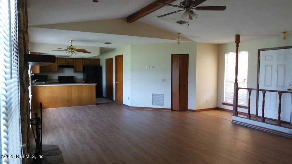 1389 Pawnee Street Orange Park, FL 32065 - Photo 3 of 13 a view of empty room with wooden floor and fan