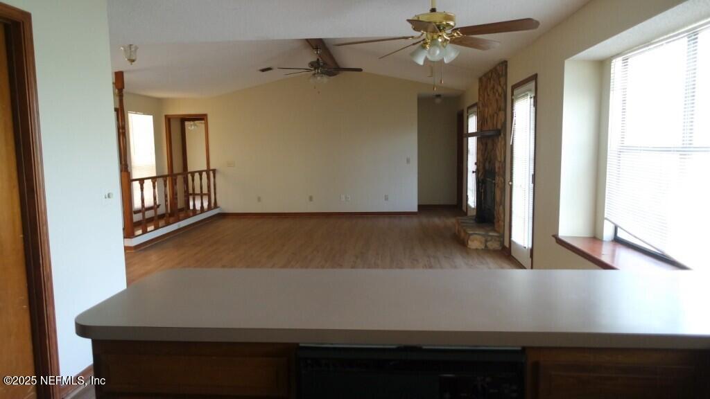 1389 Pawnee Street Orange Park, FL 32065 - Photo 5 of 13 an empty room with windows and ceiling fan