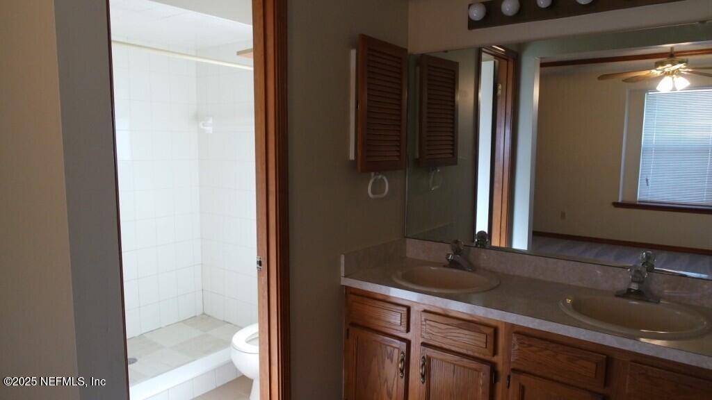 1389 Pawnee Street Orange Park, FL 32065 - Photo 8 of 13 a bathroom with a sink and a mirror