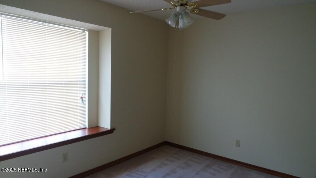 1389 Pawnee Street Orange Park, FL 32065 - Photo 9 of 13 an empty room with a window