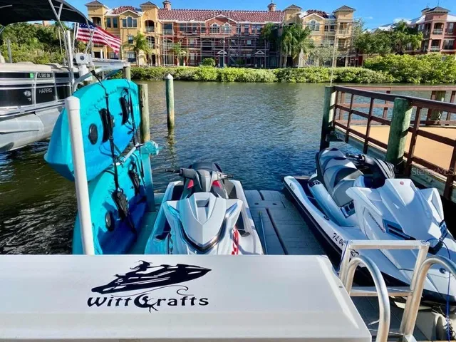 a view of a house with pool and chairs
