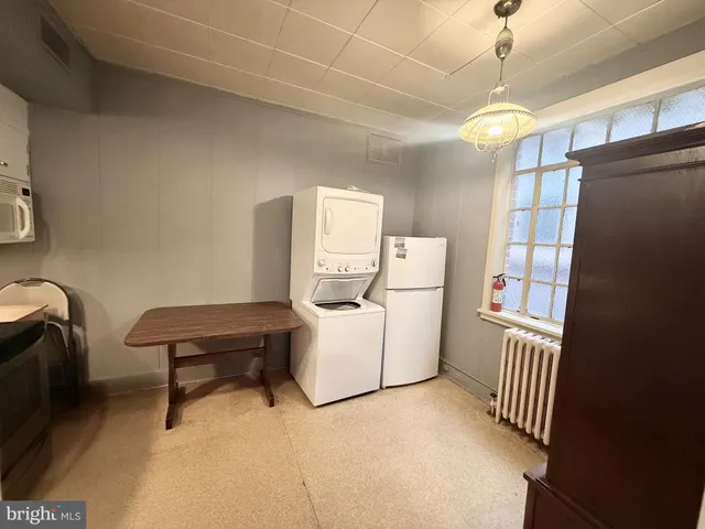 a view of a hallway with a wooden door