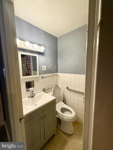 a bathroom with a shower and a sink