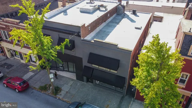 an aerial view of a house a garden and mountain view