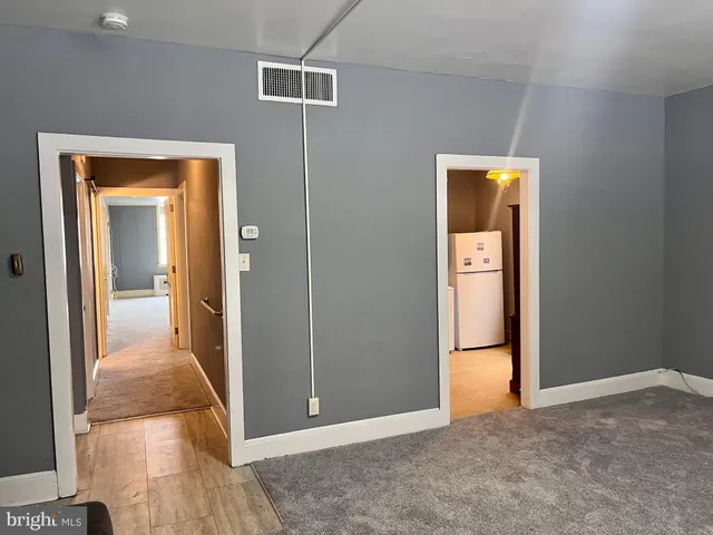 a kitchen with a stove a sink and a refrigerator