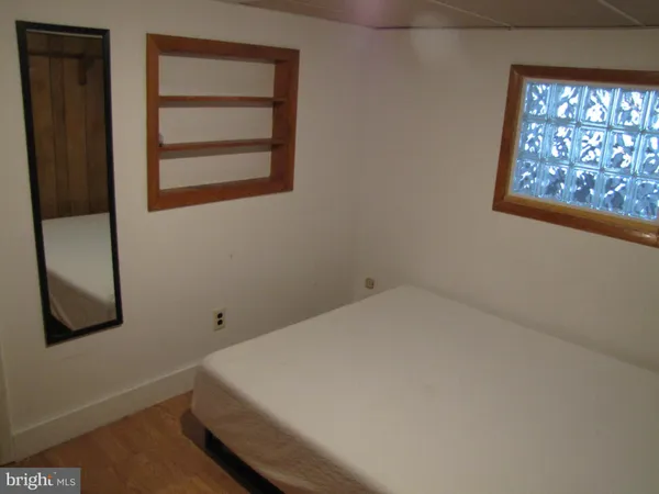 a room with a bed and a window